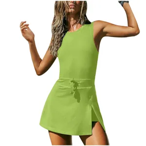 Green sleeveless athletic tennis dress detail, workout fitness romper with built-in shorts.