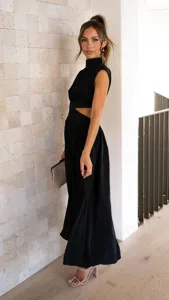 Detailed view of black mock neck sleeveless maxi dress with chic waist cutout design.