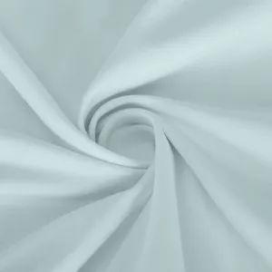 Detailed view of soft light blue athletic fabric texture with clean swirl presentation.