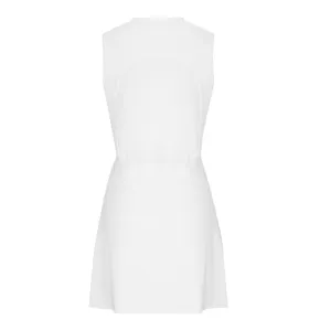 Back detail view of white athletic tennis dress, showing backless design and breathable fabric.