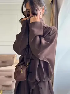 Close-up detail of the brown casual stand collar Chinese knot top and drawstring pants set.