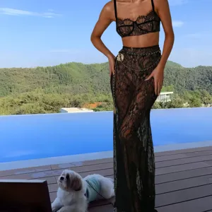 Elegant black lace two-piece set featuring a stylish crop top and long fishtail skirt.