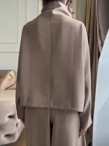 Back view detail of casual loose beige two piece set featuring a chic stand collar top.