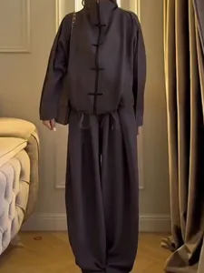 Detail view of the casual stand-collar frog button jacket and wide-leg trousers lounge set.