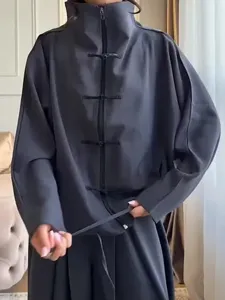 Oversized dark grey two-piece set featuring high collar, Chinese frog buttons, and drawstring.