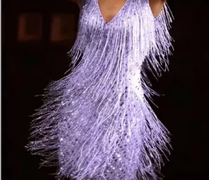 Sparkling fringe dress detail showing the shimmering lavender texture and movement.