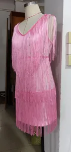 Detailed close-up view of the elegant pink fringe dress, showing tassel texture and design.