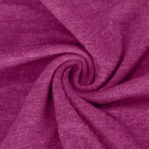 Close-up view of soft magenta knitted fabric showing fine texture and natural swirl folds.