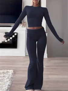 Womens long sleeve crop top and low waist flare pants two piece casual workout set detail