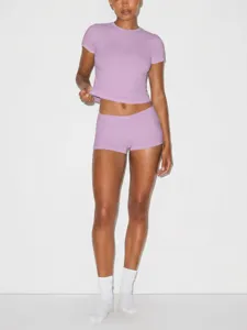 Detail view of the lavender crop top and matching shorts set, featuring a sleek fit and stretch.