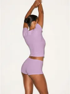 Stylish casual ribbed crop top and tight shorts athletic workout set for women daily.