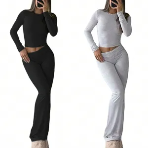 Women long sleeve crop top and low waist flare pants two piece casual tracksuit outfits.