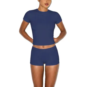 Dark blue slim-fit short sleeve crop top and tight shorts matching set for modern women