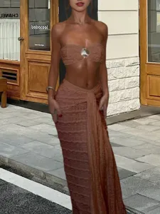Stylish women two piece outfit strapless crop top and long skirt set for summer street fashion.