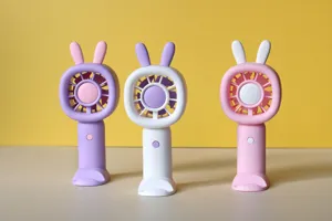 Portable handheld mini fan with base stand, USB rechargeable battery, 3-speed desktop cooling fan.