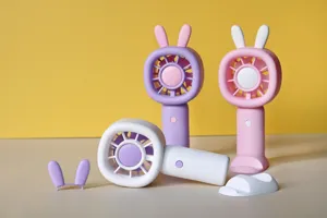 Mini handheld USB rechargeable fan with cute bunny ears and convenient desktop stand base.