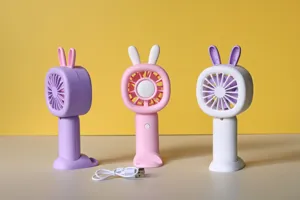 USB rechargeable handheld mini fan with cute rabbit ears and desktop base stand for students.