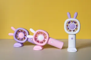 Cute bunny ear mini handheld fan detail view with desk stand and multi-speed USB rechargeable power.