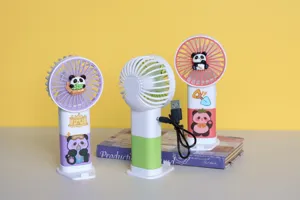 Detailed view of cute cartoon panda portable USB rechargeable handheld fan for students.