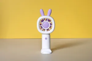 Portable handheld mini fan detail view, USB rechargeable 3-speed fan with desktop stand base.