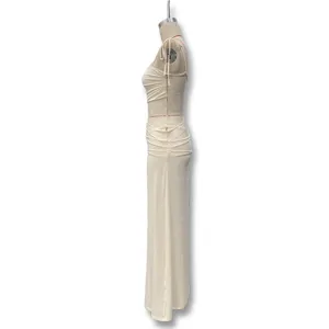 Detailed side view of sexy sleeveless lace patchwork sheer slip long dress in off-white.