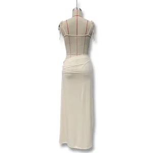 Detailed view of the back side showing lace patchwork, spaghetti straps, and draped long skirt.