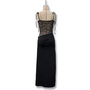 Detail view of the black lace patchwork camisole dress showing delicate sheer back design.