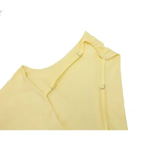 Yellow dress shoulder strap detail close-up showing fine pleats and adjustable metallic buckle.