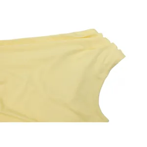 Elegant yellow chiffon dress fabric detail, exquisite one-shoulder pleated texture design.