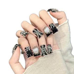Handmade gothic punk press on nails with silver rivets and heart charms, long coffin style.