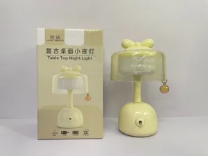Dettagli della simpatica lampada da notte con fiocco, ricarica USB e dimmer a due toni LED.