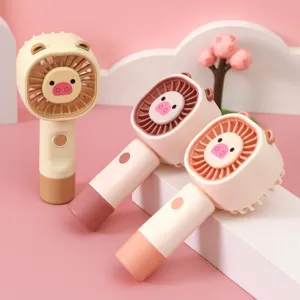 Portable handheld mini USB rechargeable fan with cute cartoon pig design for summer cooling