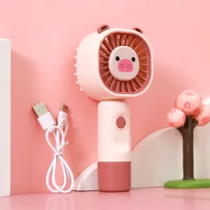 Portable handheld mini fan with cute cartoon animal design and USB charging cable for summer.