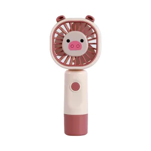 Handheld mini USB rechargeable fan with cute cartoon animal design for portable cooling use.