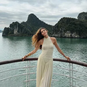 Chic beige halter neck ruched jumpsuit detail shot, elegant backless loose fit design.