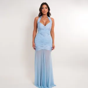 Detailed view of the halter neck, ruched bodice, and sheer mesh hemline on the dress.