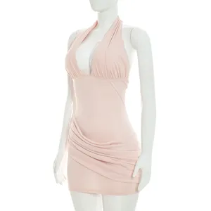 Close-up detail of pink halter neck ruched backless mini dress, summer fashion apparel.