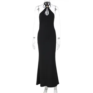 Detailed view of the elegant black halter neck long dress featuring a stylish metal buckle.