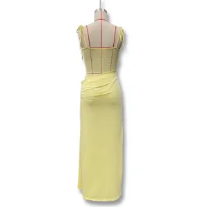Back detail of yellow lace patchwork sheer camisole long dress featuring elegant straps.
