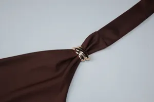 Brown halter top with gold metal ring detail, elegant summer fashion style for women.