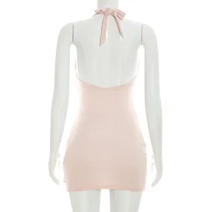 Pink halter backless mini dress, sleeveless design with tie detail, elegant summer style.