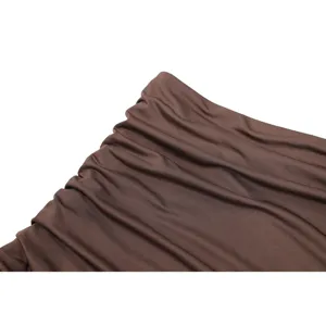 Dark brown chiffon pleated dress fabric detail close-up view showing fine texture.