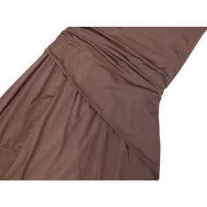 Detail view of women's one-shoulder pleated dress, showing soft brown chiffon fabric texture.