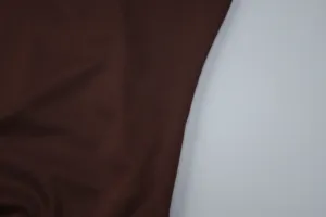 Brown fabric detail close-up showing fine texture and soft material for women summer apparel.