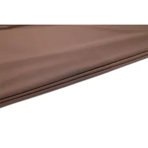 Detailed view of smooth brown chiffon fabric with elegant pleats, showing fine texture.