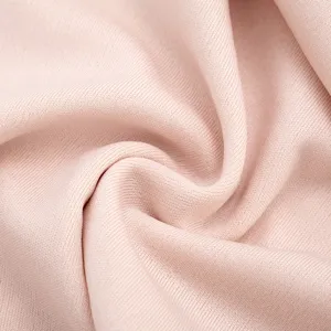 Close-up fabric detail of women solid color casual dress, showing soft texture and fine weave.