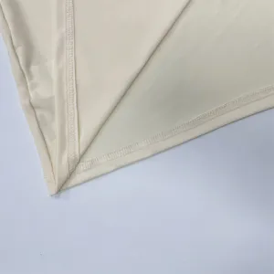Close-up detail of smooth fabric and neat stitching for women clothing, high quality.
