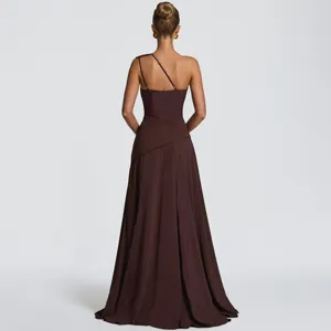 Elegant brown one-shoulder long maxi dress with pleated waist and backless design for summer.