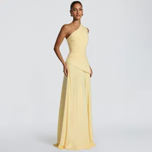 Detail view of the elegant one-shoulder draped chiffon maxi dress in a soft yellow shade.