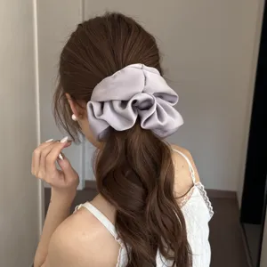 Elegant satin scrunchie for women, soft grey ponytail hair tie for stylish daily styling.